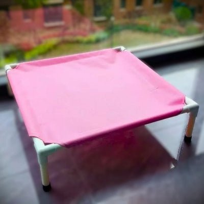 Joli lit pour chien surélevé rose